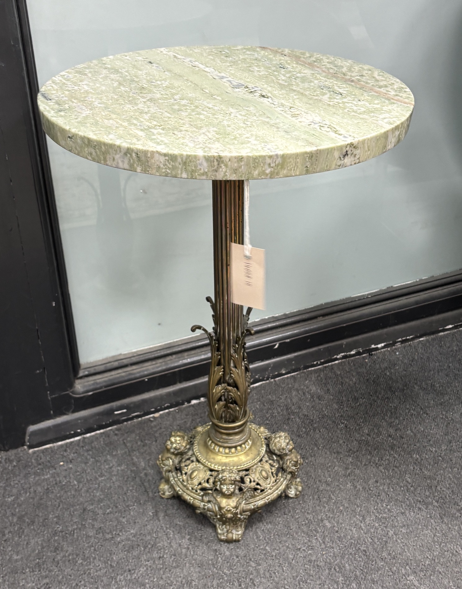 A circular marble and gilt brass occasional table, diameter 40cm, height 60cm